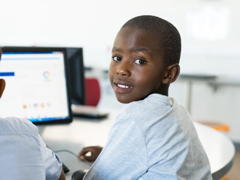 Students in a computer class supported by FIGCM