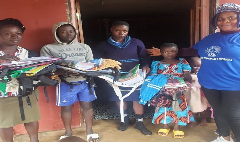 Students receiving school supplies and learning materials