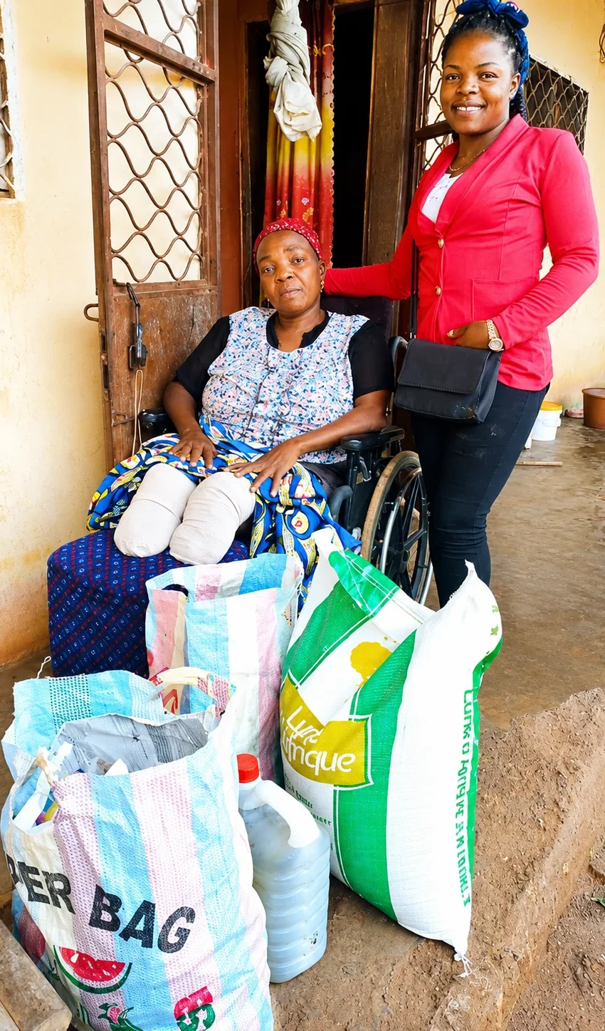 Mama Christina smiling in her safe housing provided by sustainable family support programs in Cameroon.